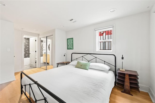 1039-41 Poland Ave, New Orleans, LA 70117 - bedroom featuring light wood-style flooring, recessed lighting, and a closet
