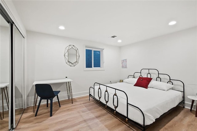 1039-41 Poland Ave, New Orleans, LA 70117 - bedroom featuring a closet, recessed lighting, and light wood-type flooring