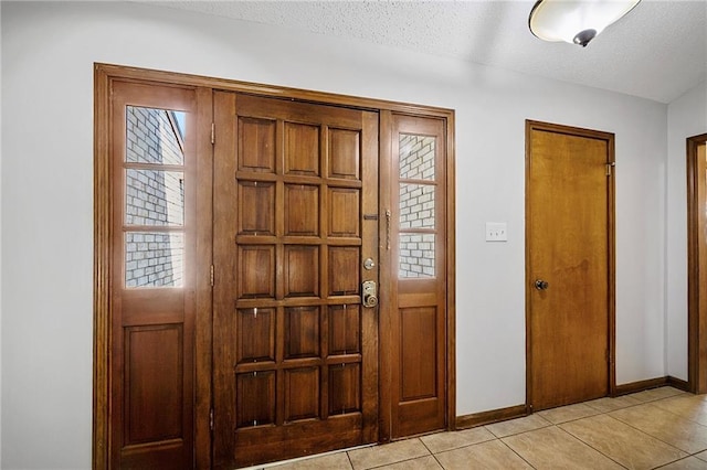 905 Rue Rochelle, Slidell, LA 70458 - foyer featuring light tile patterned floors and a textured ceiling
