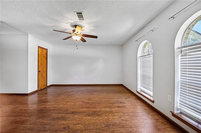 905 Rue Rochelle, Slidell, LA 70458 - empty room featuring a ceiling fan, wood finished floors, and a textured ceiling