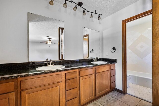 905 Rue Rochelle, Slidell, LA 70458 - full bathroom featuring a textured ceiling, double vanity, ceiling fan, and tile patterned floors