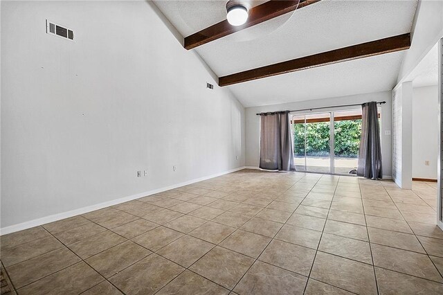 905 Rue Rochelle, Slidell, LA 70458 - tiled spare room with beam ceiling, a textured ceiling, and high vaulted ceiling