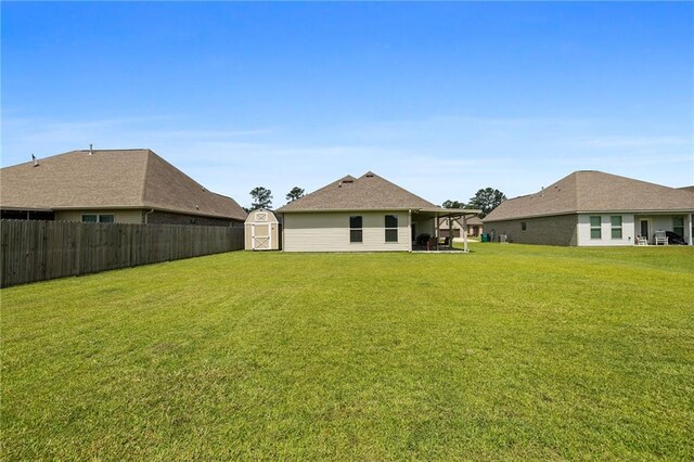 42016 Wood Ave, Ponchatoula, LA 70454 - rear view of property featuring a shed