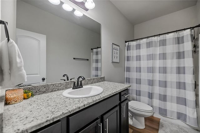 42016 Wood Ave, Ponchatoula, LA 70454 - bathroom featuring wood finished floors, vanity, and curtained shower