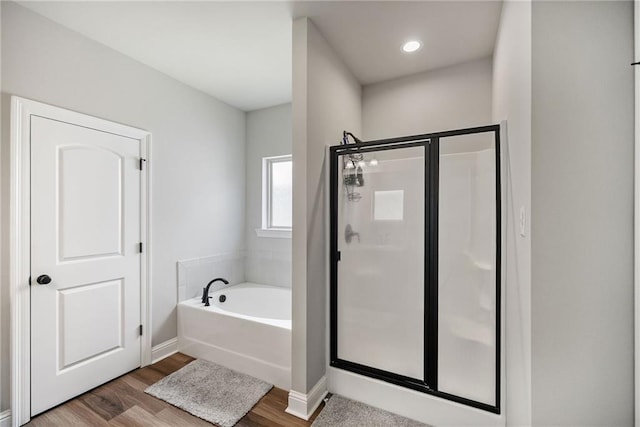 42016 Wood Ave, Ponchatoula, LA 70454 - bathroom with a shower stall, a garden tub, and wood finished floors
