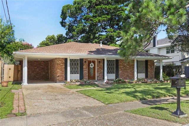 4720 Sheridan Ave, Metairie, LA 70002 - view of front of property with driveway, brick siding, and an attached carport