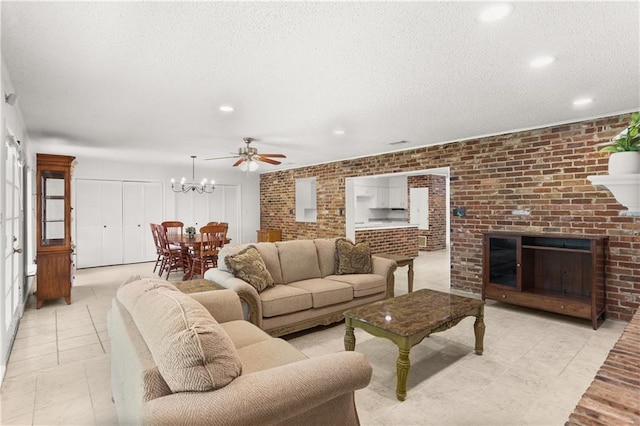 4720 Sheridan Ave, Metairie, LA 70002 - living room featuring brick wall, a chandelier, light tile patterned floors, a textured ceiling, and recessed lighting
