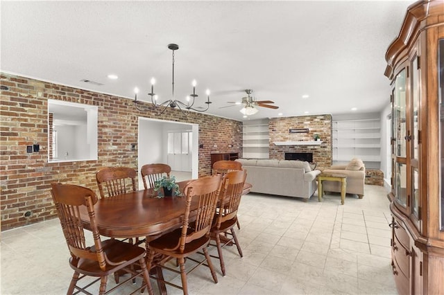 4720 Sheridan Ave, Metairie, LA 70002 - dining room featuring a brick fireplace, brick wall, a ceiling fan, and recessed lighting