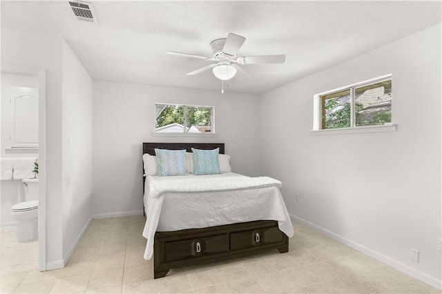 4720 Sheridan Ave, Metairie, LA 70002 - bedroom with connected bathroom, light tile patterned flooring, and ceiling fan