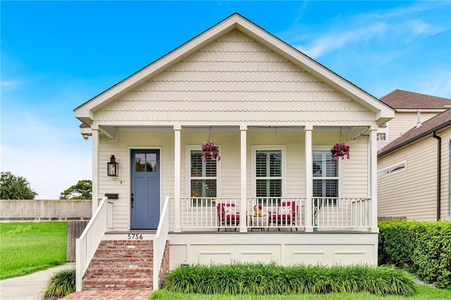 5756 Warrington Dr, New Orleans, LA 70122 - view of front facade with covered porch