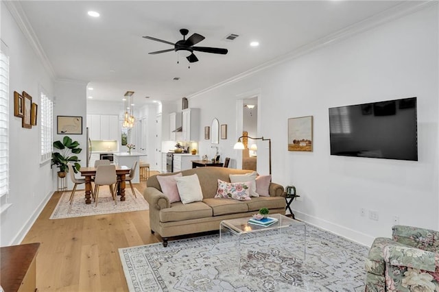 5756 Warrington Dr, New Orleans, LA 70122 - living room featuring recessed lighting, ceiling fan, light wood-style floors, and ornamental molding