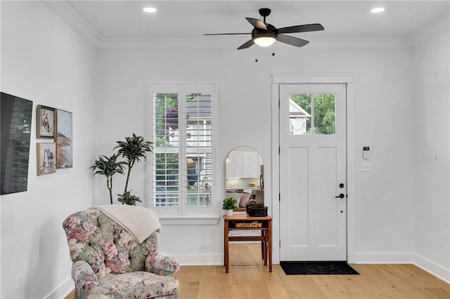 5756 Warrington Dr, New Orleans, LA 70122 - entrance foyer featuring light wood-style floors, crown molding, ceiling fan, and recessed lighting