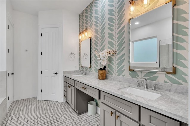 5756 Warrington Dr, New Orleans, LA 70122 - bathroom with wallpapered walls and double vanity