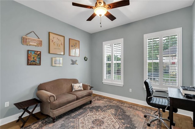 5756 Warrington Dr, New Orleans, LA 70122 - home office with ceiling fan and wood finished floors
