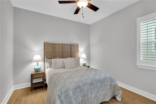5756 Warrington Dr, New Orleans, LA 70122 - bedroom featuring wood finished floors and a ceiling fan