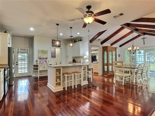 1217 W 15th Ave, Covington, LA 70433 - kitchen with open shelves, dark wood finished floors, recessed lighting, a chandelier, and a ceiling fan