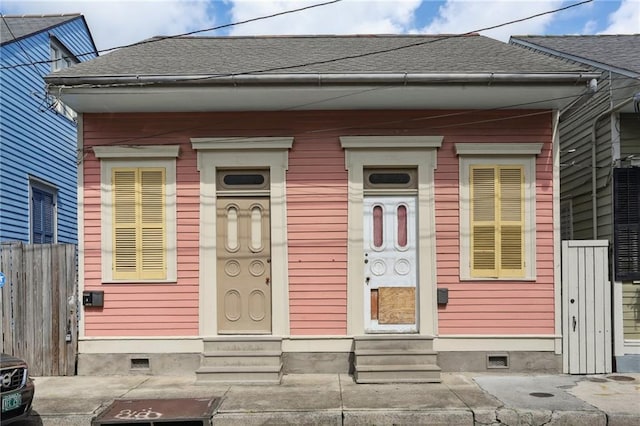 720 Port St, New Orleans, LA 70117 - entrance to property featuring crawl space and roof with shingles