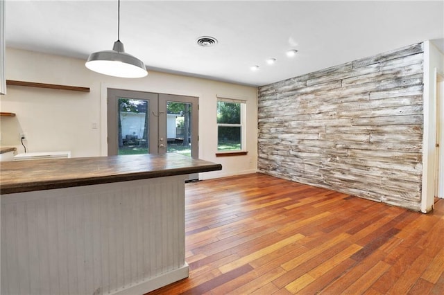 2549 Villere St, Mandeville, LA 70448 - kitchen featuring hardwood / wood-style floors, french doors, hanging light fixtures, and recessed lighting