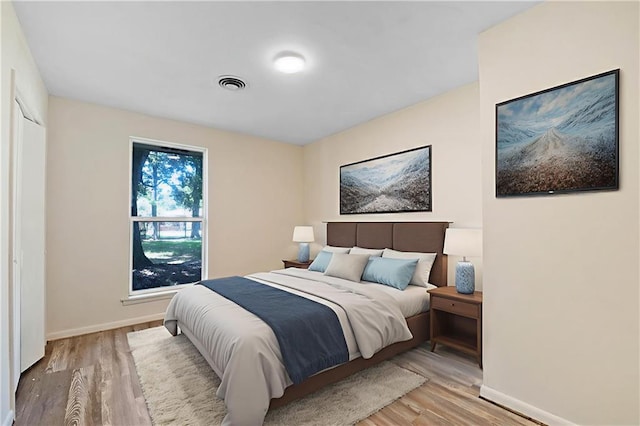 2549 Villere St, Mandeville, LA 70448 - bedroom featuring wood finished floors and baseboards