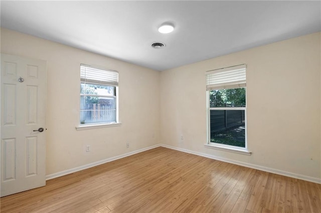 2549 Villere St, Mandeville, LA 70448 - empty room featuring light wood-style floors and plenty of natural light