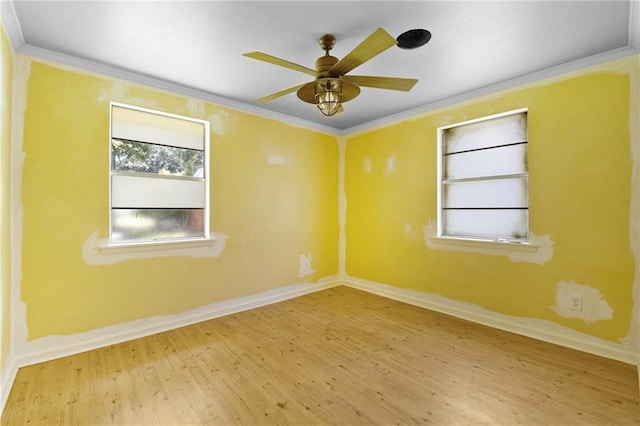 2549 Villere St, Mandeville, LA 70448 - empty room with wood finished floors, crown molding, and a ceiling fan