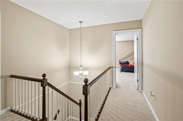 3540 Silver Maple Ct, New Orleans, LA 70131 - corridor with an upstairs landing, carpet flooring, and a chandelier