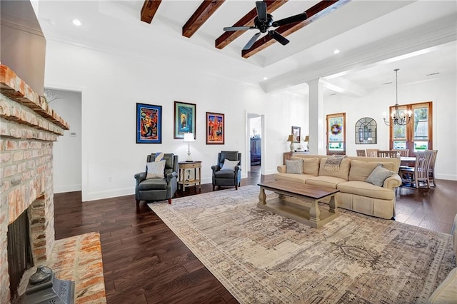 225 Chateau Papillon, Mandeville, LA 70471 - living area with a chandelier, dark wood-style flooring, beam ceiling, a ceiling fan, and a fireplace