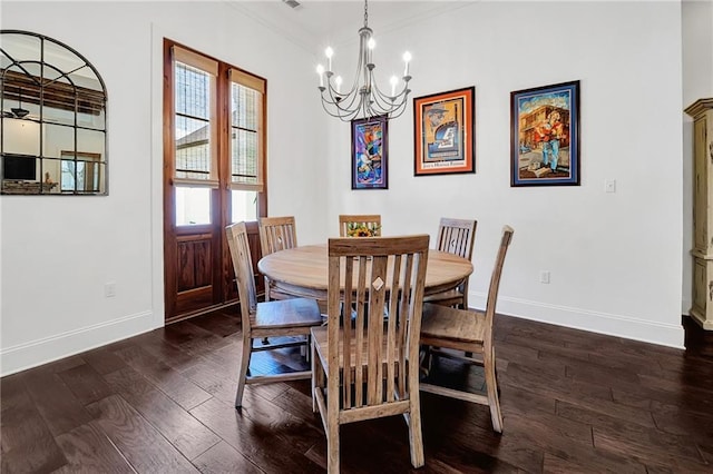 225 Chateau Papillon, Mandeville, LA 70471 - dining room featuring a chandelier, dark wood-type flooring, and crown molding