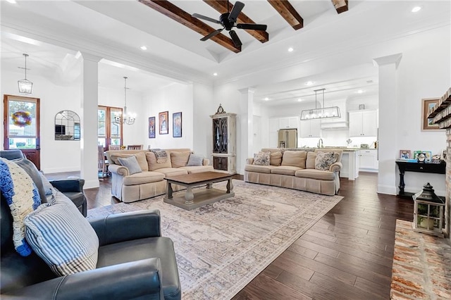225 Chateau Papillon, Mandeville, LA 70471 - living area featuring a chandelier, decorative columns, a ceiling fan, recessed lighting, and beamed ceiling