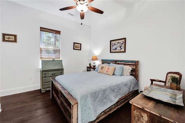 225 Chateau Papillon, Mandeville, LA 70471 - bedroom with dark wood-style flooring and a ceiling fan