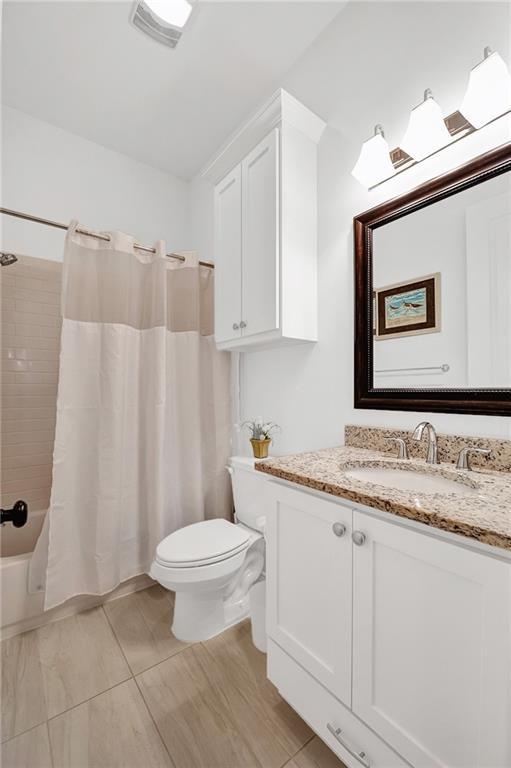 225 Chateau Papillon, Mandeville, LA 70471 - full bathroom with vanity and shower / bath combo with shower curtain