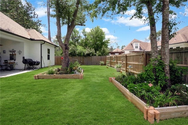 225 Chateau Papillon, Mandeville, LA 70471 - fenced backyard featuring a vegetable garden and a patio area