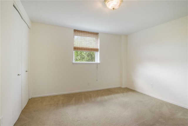 2511 St Charles Ave Unit 302, New Orleans, LA 70130 - unfurnished bedroom featuring carpet flooring and a closet