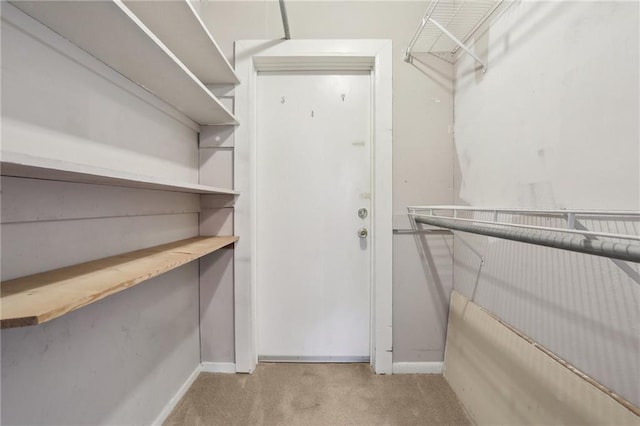 2511 St Charles Ave Unit 302, New Orleans, LA 70130 - walk in closet featuring carpet