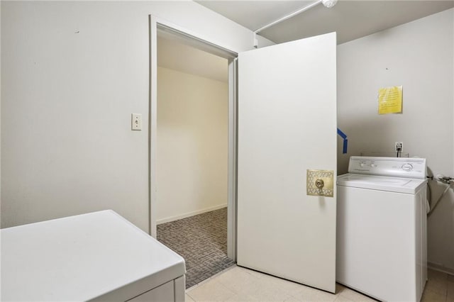 2511 St Charles Ave Unit 302, New Orleans, LA 70130 - washroom with washer / clothes dryer and light colored carpet