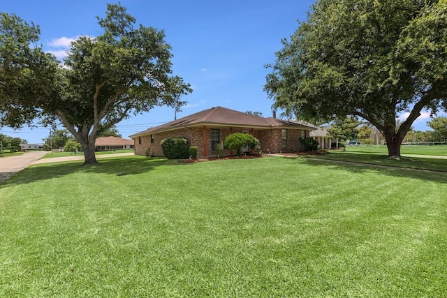 122 Warwick St, La Place, LA 70068 - view of front of property featuring a front yard and brick siding