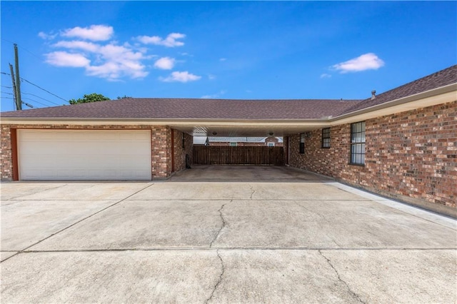 122 Warwick St, La Place, LA 70068 - view of front of property featuring driveway, brick siding, and a garage