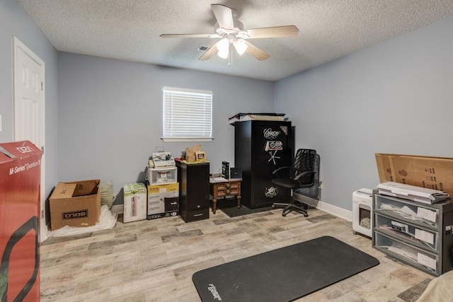122 Warwick St, La Place, LA 70068 - office area featuring a ceiling fan, a textured ceiling, and wood finished floors