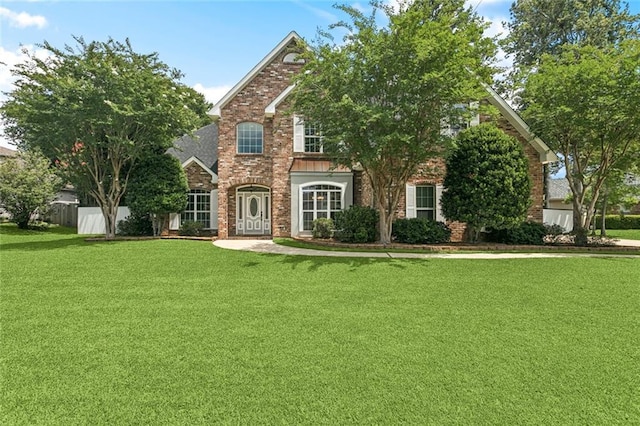 89 Catalpa Trce, Covington, LA 70433 - traditional home with a front lawn and brick siding