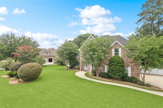 89 Catalpa Trce, Covington, LA 70433 - view of front facade with a front yard and brick siding