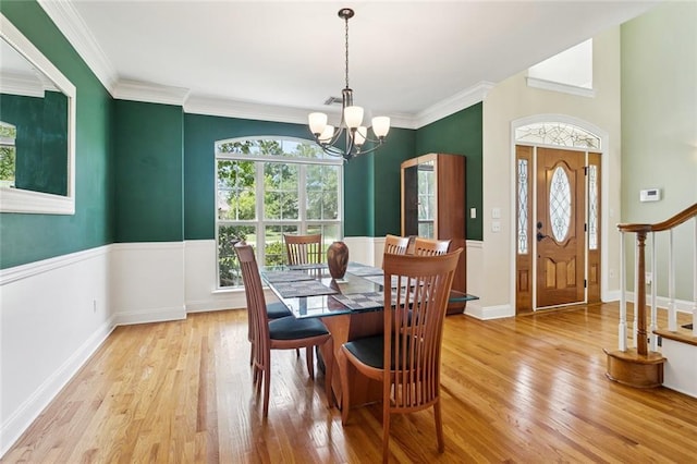 89 Catalpa Trce, Covington, LA 70433 - dining room with a chandelier, wood finished floors, stairway, and ornamental molding