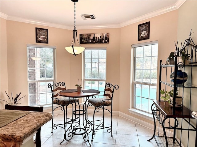 89 Catalpa Trce, Covington, LA 70433 - dining space with healthy amount of natural light, ornamental molding, and light tile patterned floors