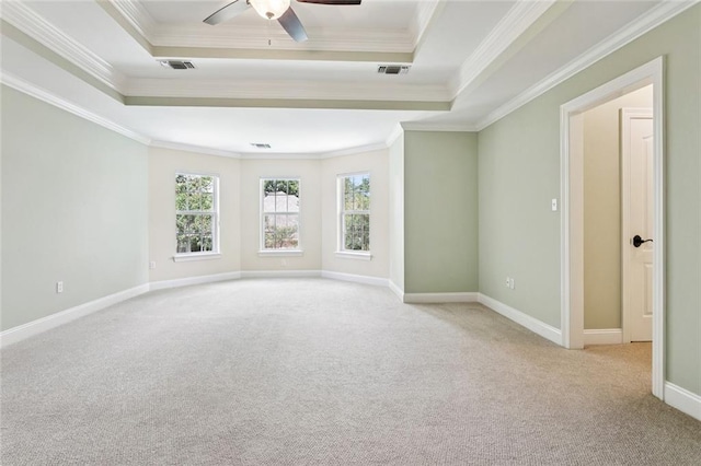 89 Catalpa Trce, Covington, LA 70433 - unfurnished room featuring a tray ceiling, healthy amount of natural light, carpet, and crown molding