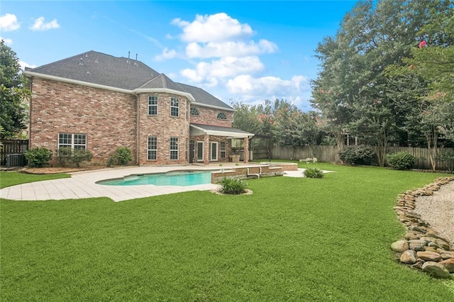 89 Catalpa Trce, Covington, LA 70433 - rear view of property featuring brick siding, a patio area, and a fenced backyard