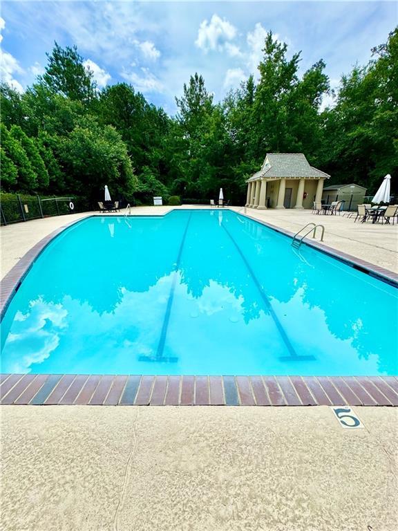 89 Catalpa Trce, Covington, LA 70433 - community pool with a patio and view of scattered trees