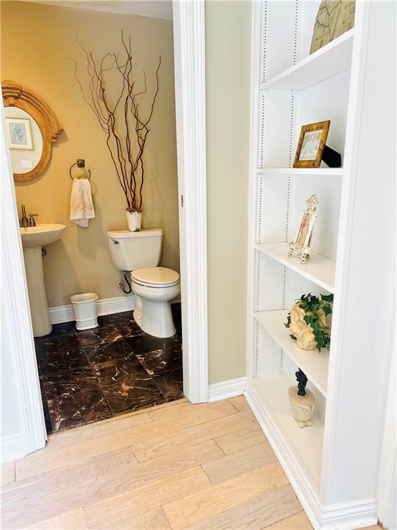 14 Riverbend Ln, Covington, LA 70433 - bathroom with toilet and wood finished floors