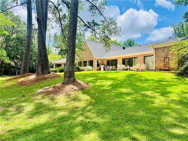 14 Riverbend Ln, Covington, LA 70433 - back of property featuring brick siding and a yard