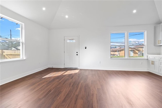 507 Westwego Ave, Westwego, LA 70094 - unfurnished living room featuring dark wood finished floors, plenty of natural light, recessed lighting, and lofted ceiling