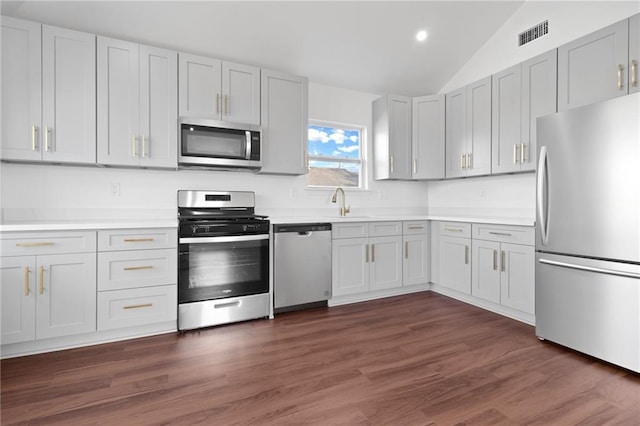 507 Westwego Ave, Westwego, LA 70094 - kitchen featuring stainless steel appliances, lofted ceiling, light countertops, recessed lighting, and dark wood-style floors
