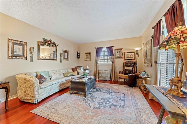101 E Queensbury Dr, Slidell, LA 70461 - living area with wood finished floors and a textured ceiling